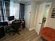 Bright home office with a desk, chair, and open door at 2152 Arcadia Rd, Holiday, FL 34690