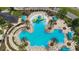 Community pool with unique design and surrounding lounge chairs at 22103 Blazing Star Run, Land O Lakes, FL 34637