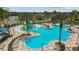 Irregular shaped pool with water features and lounge chairs at 22103 Blazing Star Run, Land O Lakes, FL 34637