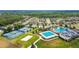 Aerial view of community with pools, tennis and basketball courts at 22103 Blazing Star Run, Land O Lakes, FL 34637