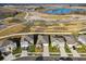 Aerial view of a new residential community with houses, lake, and walking paths at 22103 Blazing Star Run, Land O Lakes, FL 34637