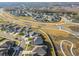 Aerial view of a large residential community with houses and a lake at 22103 Blazing Star Run, Land O Lakes, FL 34637