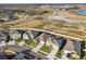 Aerial view of a new residential community with houses, lake, and walking paths at 22103 Blazing Star Run, Land O Lakes, FL 34637