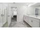 Bathroom with double vanity and a view of bedroom at 22103 Blazing Star Run, Land O Lakes, FL 34637