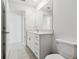 Simple bathroom with white vanity and toilet at 22103 Blazing Star Run, Land O Lakes, FL 34637