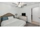 Well lit bedroom with ceiling fan and dresser at 22103 Blazing Star Run, Land O Lakes, FL 34637