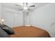 Bright bedroom with double door closet and ceiling fan at 22103 Blazing Star Run, Land O Lakes, FL 34637