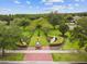 Landscaped community garden with brick path at 22103 Blazing Star Run, Land O Lakes, FL 34637