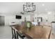 Open concept dining room with modern chandelier and kitchen views at 22103 Blazing Star Run, Land O Lakes, FL 34637