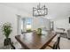 Bright dining room with a large wooden table and access to backyard at 22103 Blazing Star Run, Land O Lakes, FL 34637