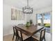 Bright dining room with a large wooden table and access to backyard at 22103 Blazing Star Run, Land O Lakes, FL 34637