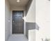 Dark brown front door entryway with recessed lighting and neutral colored walls at 22103 Blazing Star Run, Land O Lakes, FL 34637
