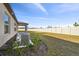 Back exterior view of house with AC unit and covered patio at 22103 Blazing Star Run, Land O Lakes, FL 34637