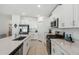 Modern kitchen with stainless steel appliances and white cabinetry at 22103 Blazing Star Run, Land O Lakes, FL 34637