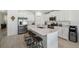 Modern kitchen with stainless steel appliances and white cabinetry at 22103 Blazing Star Run, Land O Lakes, FL 34637