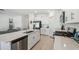Modern kitchen with stainless steel appliances and white cabinetry at 22103 Blazing Star Run, Land O Lakes, FL 34637