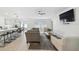 Open living room with large TV and comfy seating at 22103 Blazing Star Run, Land O Lakes, FL 34637