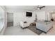 Living room with large TV and comfortable seating at 22103 Blazing Star Run, Land O Lakes, FL 34637
