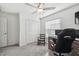 Bright home office with built-in closet and rocking chair at 22103 Blazing Star Run, Land O Lakes, FL 34637