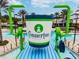 Giant Connerton-themed cup water feature in a community pool at 22103 Blazing Star Run, Land O Lakes, FL 34637