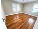 Bright bedroom with hardwood floors and two windows at 2720 9Th N Ave, St Petersburg, FL 33713