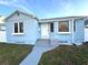 Charming light blue house with white trim, steps, and walkway at 2720 9Th N Ave, St Petersburg, FL 33713