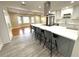 Modern kitchen with white cabinets, island, and stainless steel appliances at 2720 9Th N Ave, St Petersburg, FL 33713