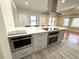 Island kitchen with stainless steel appliances and white cabinets at 2720 9Th N Ave, St Petersburg, FL 33713