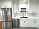 Modern kitchen with stainless steel appliances and white cabinets at 2720 9Th N Ave, St Petersburg, FL 33713