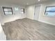Living room with gray vinyl plank flooring and neutral walls at 2720 9Th N Ave, St Petersburg, FL 33713