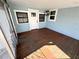 Screened porch with wood flooring and access to backyard at 2720 9Th N Ave, St Petersburg, FL 33713