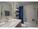Bathroom features a vanity with a white sink and a shower/tub combo at 305 E Hanlon St, Tampa, FL 33604