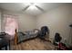 Bedroom with wood-look floors and window at 305 E Hanlon St, Tampa, FL 33604