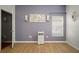Bedroom with hardwood floors, neutral walls and window with blinds at 305 E Hanlon St, Tampa, FL 33604
