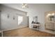 Spacious bedroom with hardwood floors and en-suite bathroom access at 305 E Hanlon St, Tampa, FL 33604