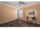 Bedroom with hardwood floors and vanity with lighted mirror at 305 E Hanlon St, Tampa, FL 33604