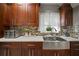 Modern kitchen with farmhouse sink and dark wood cabinets at 305 E Hanlon St, Tampa, FL 33604