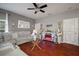 Living room with hardwood floors, sectional sofa, and electric fireplace at 305 E Hanlon St, Tampa, FL 33604