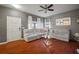 Living room features hardwood floors, sectional sofa, and neutral wall colors at 305 E Hanlon St, Tampa, FL 33604