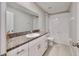 Bathroom with white vanity, granite countertop, and bathtub at 3059 Nubbin Ridge Ln, Zephyrhills, FL 33540