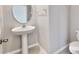 Simple pedestal sink and toilet at 3059 Nubbin Ridge Ln, Zephyrhills, FL 33540