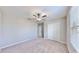 Bright bedroom with ceiling fan and neutral wall paint at 3059 Nubbin Ridge Ln, Zephyrhills, FL 33540