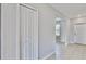 Bright foyer with tile floors and coat closet at 3059 Nubbin Ridge Ln, Zephyrhills, FL 33540