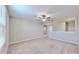 Bright loft with neutral wall paint and carpeting, plus a ceiling fan at 3059 Nubbin Ridge Ln, Zephyrhills, FL 33540
