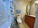 Clean bathroom with shower/tub combo and wood vanity at 34071 Avocado N Dr, Pinellas Park, FL 33781