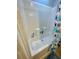Clean bathroom with tub/shower and white tile surround at 34071 Avocado N Dr, Pinellas Park, FL 33781