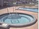 An inviting community hot tub with easy access steps and a geometric design at 34071 Avocado N Dr, Pinellas Park, FL 33781