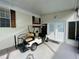 Covered patio with golf cart and entrance to the home at 34071 Avocado N Dr, Pinellas Park, FL 33781