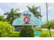 Entrance sign to Sunset Palms community, with palm trees at 34071 Avocado N Dr, Pinellas Park, FL 33781