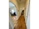 Light-filled hallway with wood-look floors and access to living areas at 34071 Avocado N Dr, Pinellas Park, FL 33781
